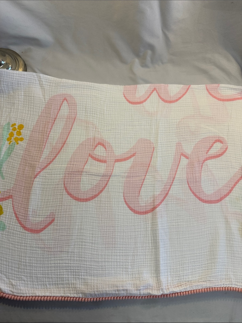 cloud island muslin blanket with “you are loved” Script & Yellow Floral Accents